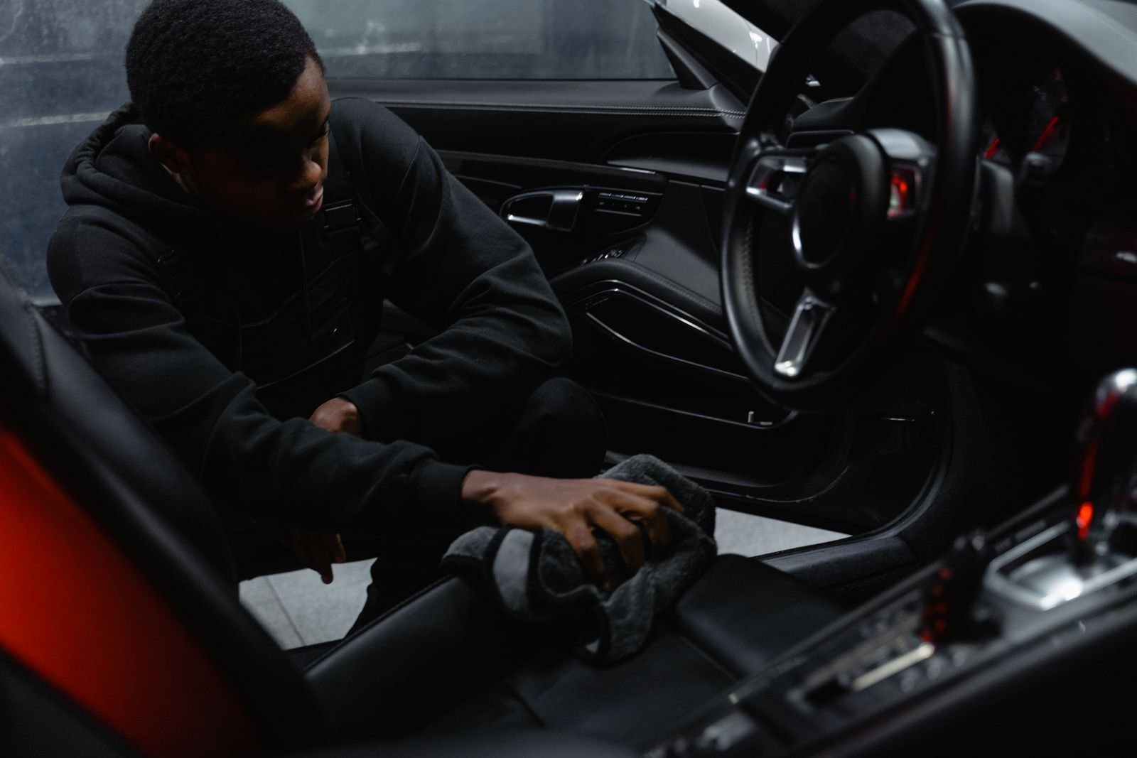 Technician cleaning a car interior