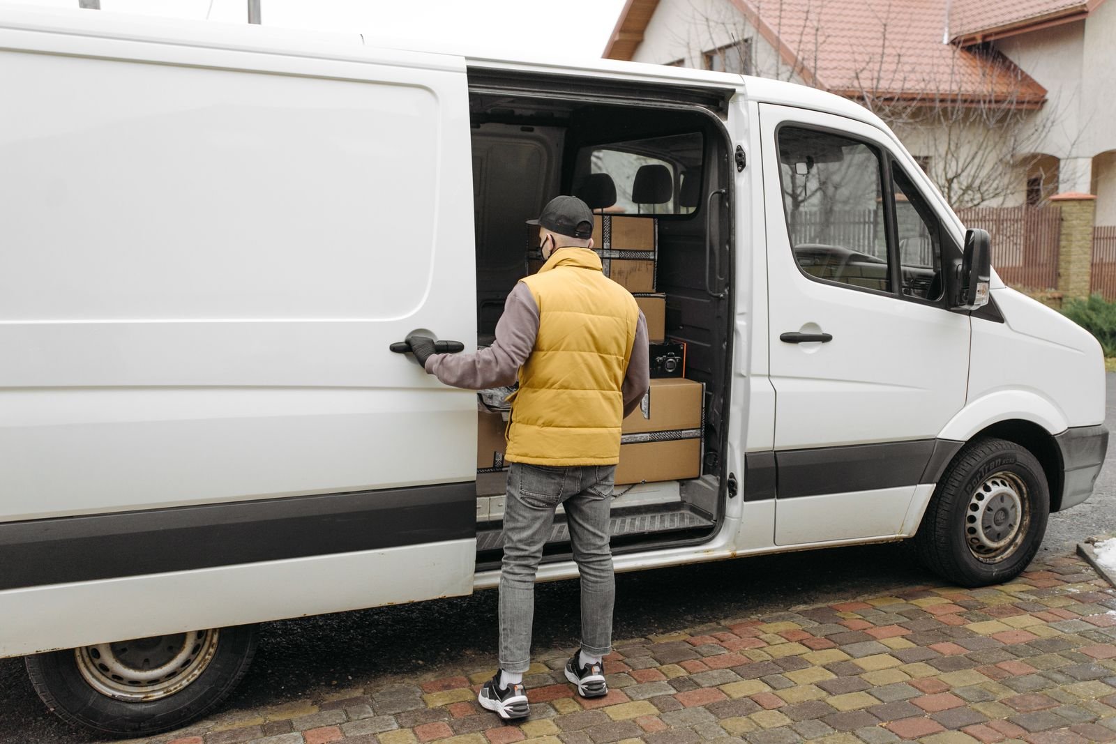Service technician loading equipment from the van